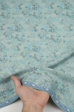 Teal blue Arvind Jacquard cotton unstitched shirting fabric, detailed woven pattern, suitable for custom shirts or garments.