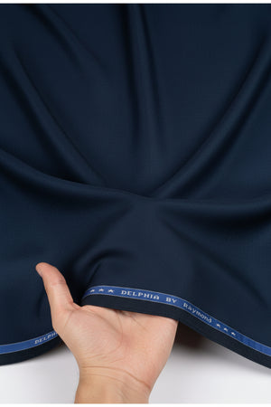 Navy blue Raymond poly viscose trousers and suiting fabric, showcasing the textile's texture and fabric drape.