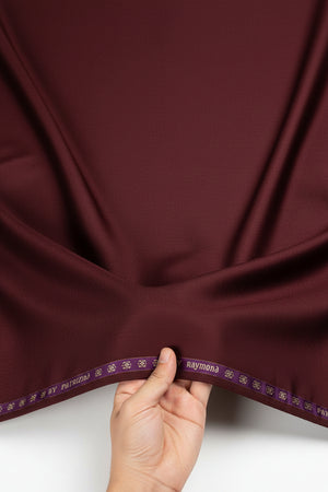 Raymond Luxurious Unstitched Polywool Trousers and Suiting Fabric in red, showing the fabric's texture and rich color.