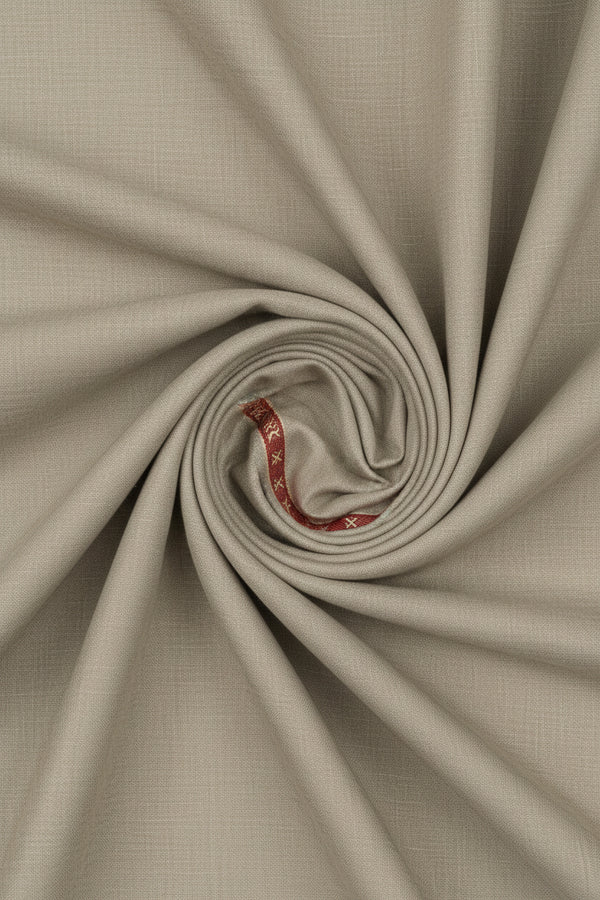 Beige Raymond poly wool trouser fabric swatch showing a smooth, premium wool blend textile for suiting or trousers.