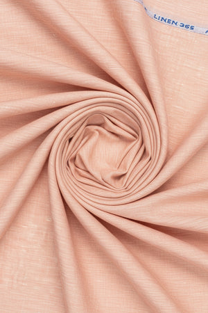 Deep peach Arvind linen shirt fabric, unstitched plain textile suitable for making custom shirts, shown in close-up view.