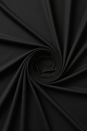 Black Tessuti satin unstitched shirting fabric by Mensfabric, close-up of smooth, glossy black satin material for tailoring.