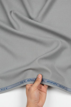 Gray cloud polyviscose trousers and suiting fabric by Raymond, unstitched fabric for custom tailoring, detailed fabric texture visible.