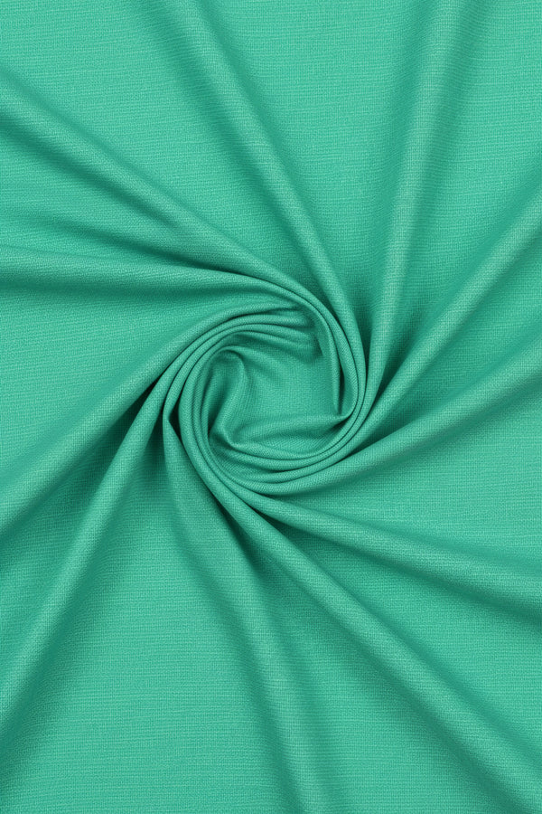 ARVIND Tresca Giza cotton shirt fabric in parrot green, showing a close-up of the textured, high-quality cotton material.