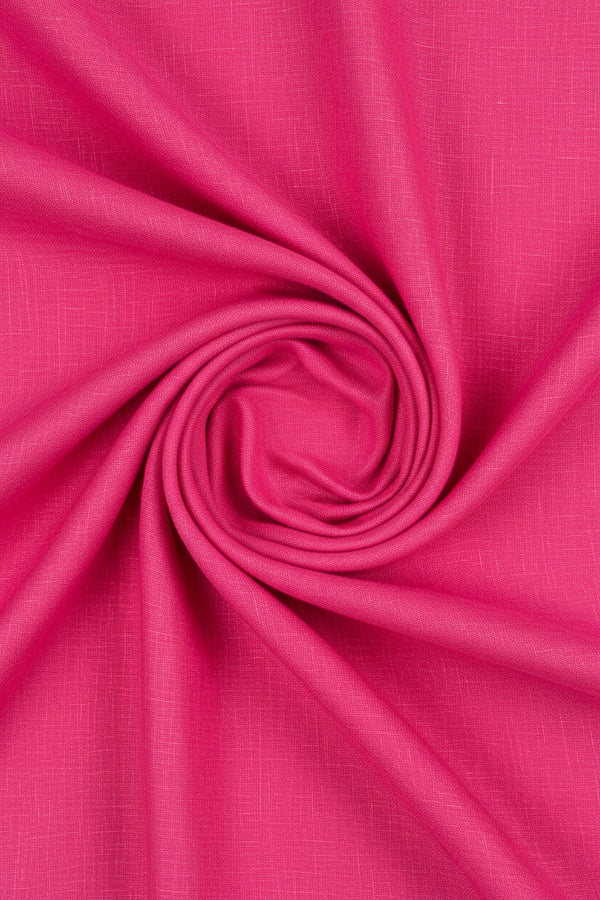 Light pink Arvind linen shirt fabric with a French Rose pattern, showcasing soft texture and intricate floral design.