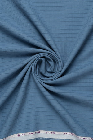 Blue striped linen shirting fabric by ARVIND, showing a close-up of the lightweight, textured linen material with subtle stripe pattern.