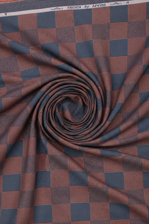Brown and blue check Tresca cotton shirting fabric by Arvind, showing a close-up of the unstitched fabric with checked pattern.