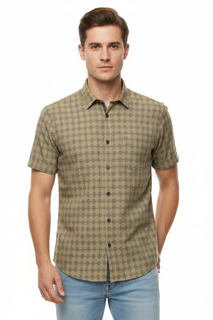 Unstitched Tresca cotton shirting fabric by Arvind in camouflage yellow, showcasing the fabric's soft texture and vibrant pattern.