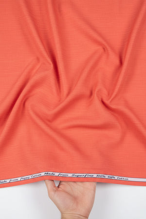 Orange Arvind Tresca cotton unstitched shirting fabric, textured textile with subtle pattern, ideal for custom shirts.