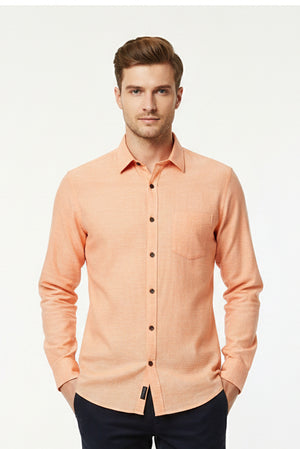 Light orange Arvind Tresca cotton unstitched shirting fabric with a soft, smooth texture and classic woven pattern.