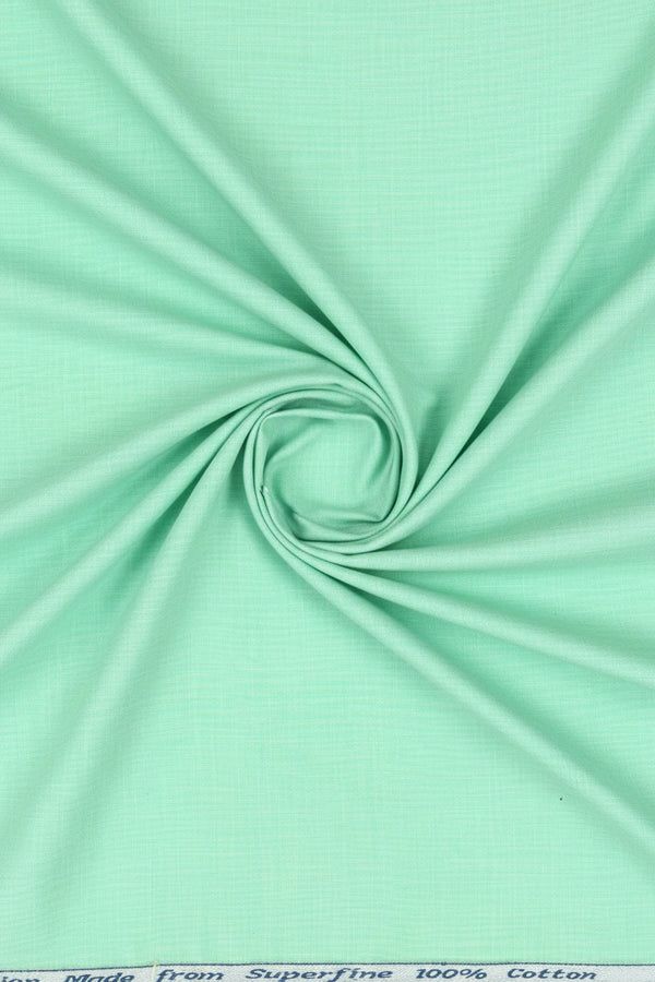 Mint green Arvind Tresca shirting fabric in Giza cotton, showing the smooth texture and vibrant color of the fabric.