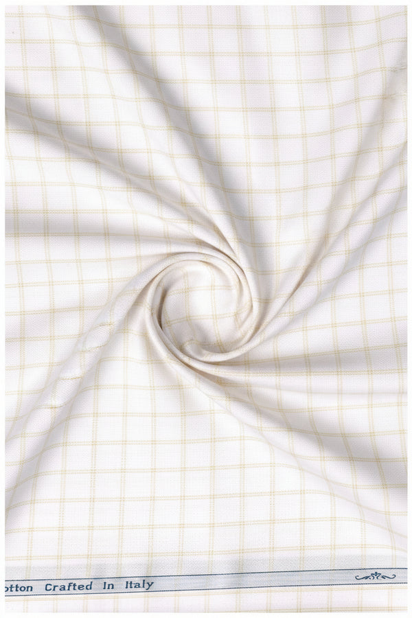Beige and white checkered cotton shirting fabric from Arvind Primante with a classic checked pattern.