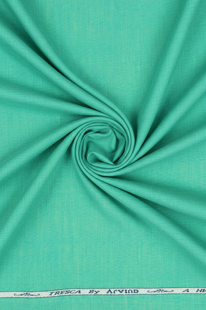 Aquamarine green Arvind Tresca cotton shirting fabric, close-up of textured woven material with vibrant color and soft finish.