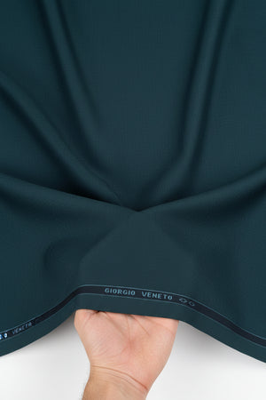 Georgia Veneto 150’s Italian poly wool suiting fabric in indigo dye blue, featuring a close-up of the textured textile.