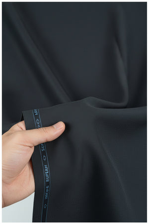 Georgia Veneto 150’s Italian poly wool trouser fabric in natural indigo blue, showing a close-up of the textured woven material.