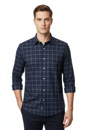 Navy blue Tresca cotton checks shirting fabric by Arvind, showing a close-up of the soft, unstitched textile with check pattern.
