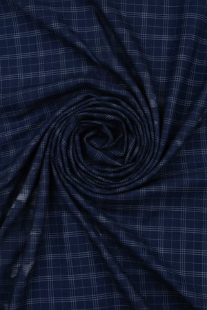 Navy blue Tresca cotton checks shirting fabric by Arvind, showcasing a close-up view of the lightweight, high-quality textile.