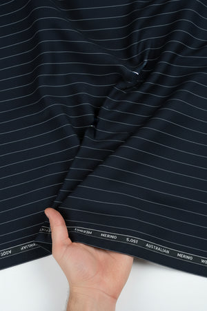 White striped on grey Menzoni 150's Italian poly wool trouser fabric, shown in a close-up of the textured woven material.