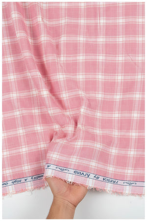 Pink and white plaid fabric with 'Tresca by Arvind' branding on a white background