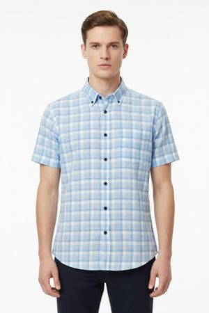 Crystal blue Tresca cotton checks shirting fabric by Arvind, showcasing soft, unstitched cotton material with a classic check pattern.