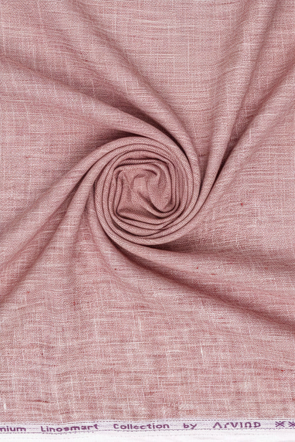 Light coral linen fabric from Arvind Tresca shirt fabric collection, showcasing smooth, plain linen material for shirts.