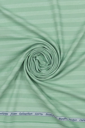 Green fabric with a subtle pattern and label at the top