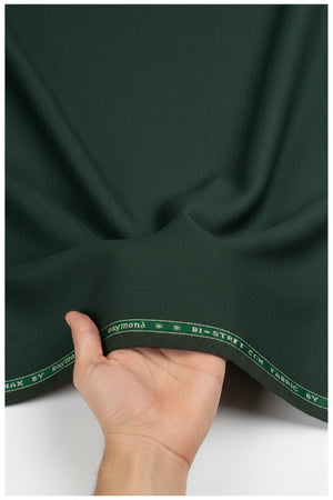 Raymond polywool trousers and suiting fabric in seaweed green with Lycra stretch, showing fabric texture and color detail.