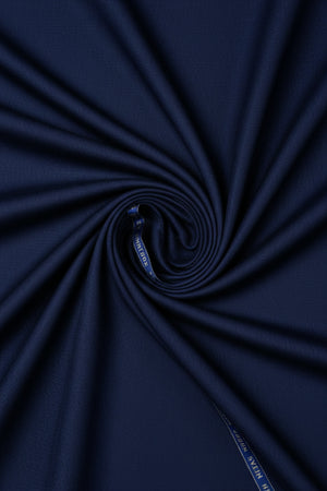 Royal blue Raymond polywool fabric for trousers and suiting, showing a smooth, luxurious textured textile.