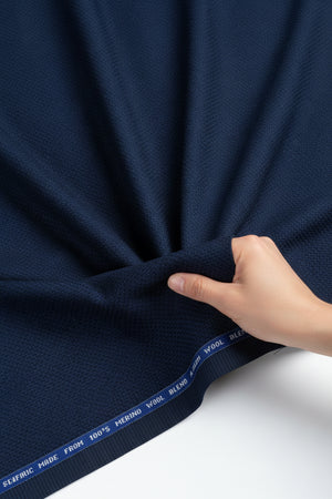Raymond navy blue Super 100's poly wool trousers and suiting fabric, unstitched textile with a smooth, professional appearance.