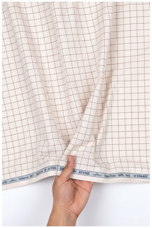 Beige Arvind cotton shirting fabric with a smooth texture, ideal for shirt-making and tailored garments.