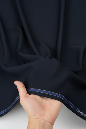 Navy blue Mafatlal unstitched poly viscose trouser and suiting fabric, detailed fabric texture and color in a close-up image.