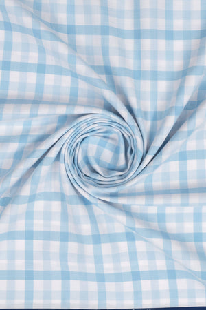 Sky blue Arvind cotton checks shirting fabric, unstitched material for shirts, featuring a classic check pattern and soft cotton texture.