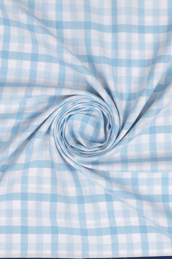 Sky blue Giza cotton checks fabric by ARVIND Tresca, featuring a lightweight, breathable shirt material with a classic check pattern.