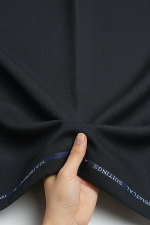 Charcoal grey Mafatlal unstitched poly viscose trouser and suiting fabric, shown in a close-up of the textured textile.