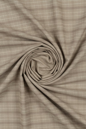 Arvind Tresca shirt fabric with brown check pattern on beige tan background, made of premium cotton for shirting.