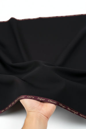 Georgia Gullini of Italy black polywool Super 120’s suit trousers fabric, showcasing smooth texture and fine tailoring details.