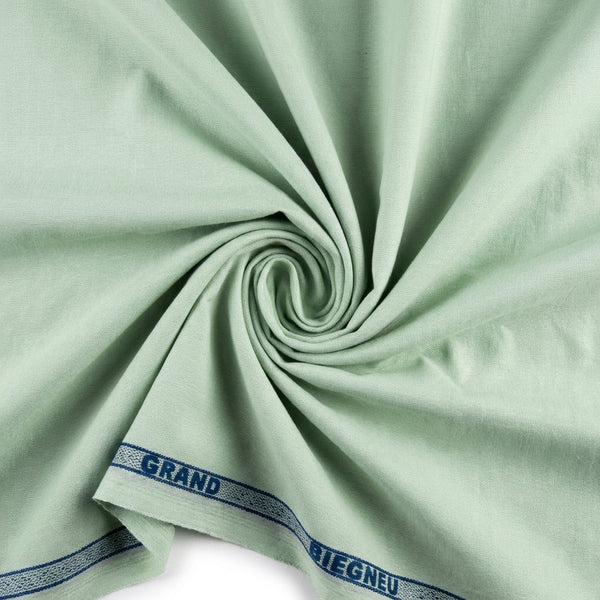 Pista green Arvind Tresca Giza cotton shirting fabric with a subtle swirl pattern, showcasing soft, high-quality textile.