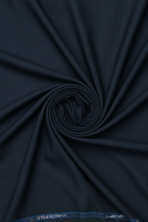 Dark slate blue Mafatlal poly wool suiting fabric with a smooth wool blend texture, ideal for tailored suits and formal wear.