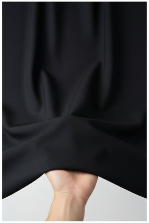 Black Mafatlal Polyviscose trouser and suiting fabric shown, showcasing the textured weave and fabric detail.
