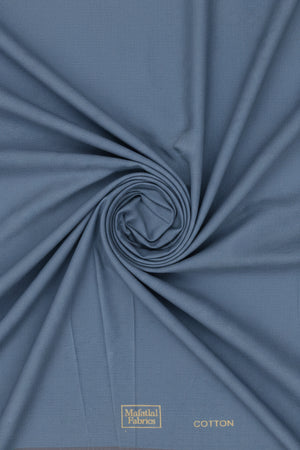 Close-up of a blue fabric with 'Cotton Fabrics' branding.