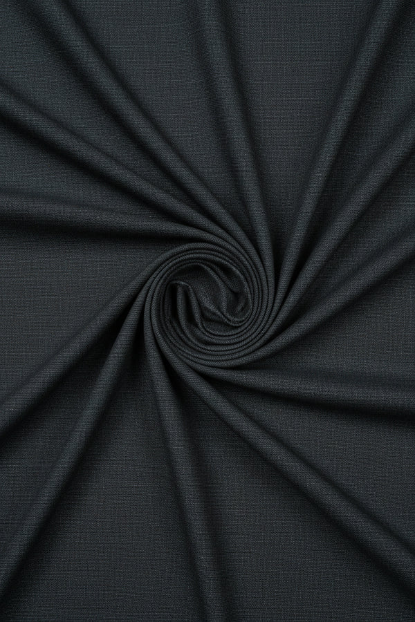 Grey Mafatlal poly wool suiting fabric, wool blend material with a smooth texture, suitable for tailored suits and formal wear.