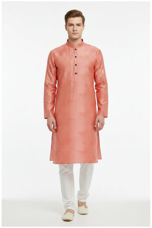 Arvind Jacquard cotton shirting fabric in vibrant carrot orange with intricate woven pattern, ideal for stylish shirts.