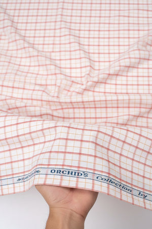 Carrot orange Arvind Checks cotton shirting fabric with a plaid pattern, suitable for shirts and apparel.