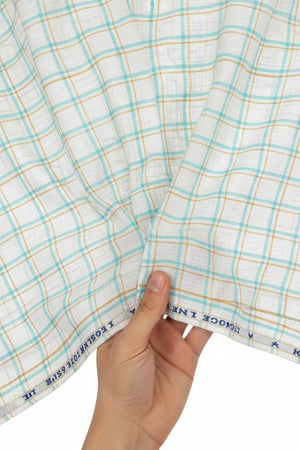 Blue and beige Arvind linen checks shirting fabric, unstitched textile for custom shirts, featuring classic check pattern and soft linen texture.
