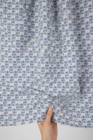 Lavender Pee Gee digital print cotton shirting fabric, showcasing a detailed floral pattern on smooth fabric.