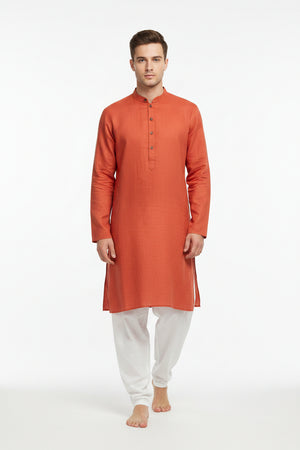 Plain reef orange linen shirting fabric by ARVIND, showing smooth textured fabric with natural linen weave detail.