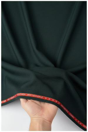 Green Spinach Raymond luxurious unstitched poly wool fabric for trousers and suiting, with a smooth textured appearance.