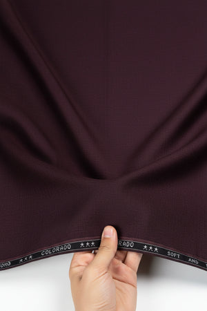 Dark purple fabric with 'Raymond Colorado' label at the top.