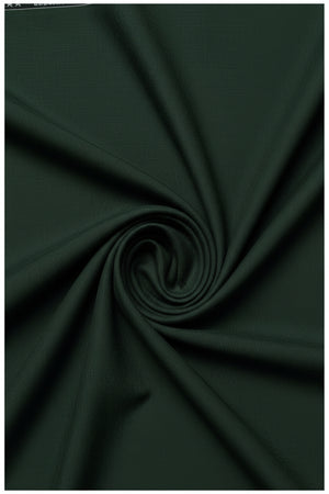 Green Raymond Polyviscose trousers and suiting fabric swatch, showcasing smooth, lightweight fabric with subtle texture.
