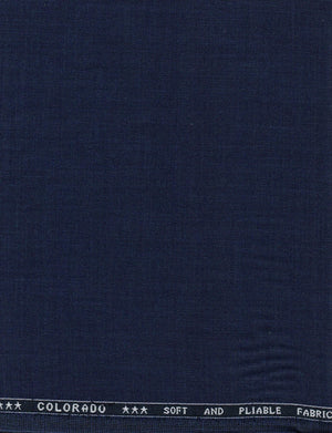 Navy blue Raymond Terry rayon trousers and suiting fabric, showing the textured fabric and tailored fit.